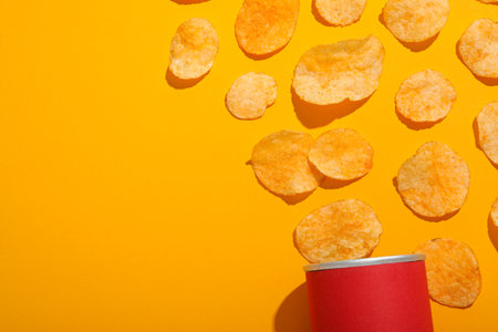 Potato chips with a red tube on a yellow background