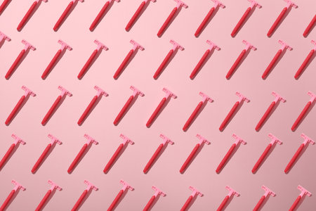 Razor for shaving on a pink background