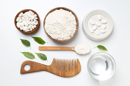 Collagen in powder and tablets with a wooden combの写真素材