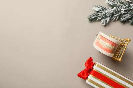 Teeth with Christmas accessories around, flat lay.