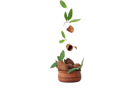 PNG, Ripe tamarind with leaves in a bowl, isolated on white background