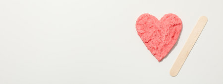 Depilatory paste in the shape of a heart on a light backgroundの写真素材