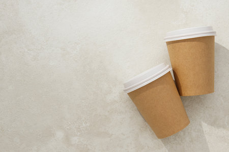 Paper cups with lids on a light backgroundの写真素材