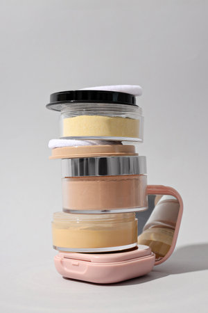 Face powder, light shade on a light background.
