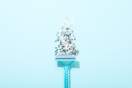 Blue razor for shaving with decorative sequins
