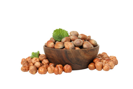 PNG, Peeled and unshelled hazelnuts in bowl, isolated on white background