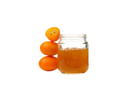 Fresh kumquat fruits and jar of jam, isolated on white backgroundの写真素材
