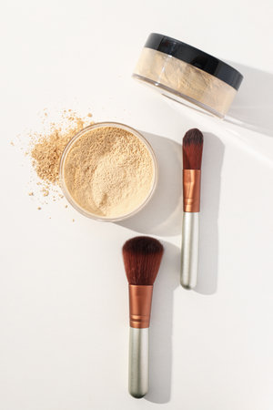 Face powder with a brush, on a light background.の写真素材