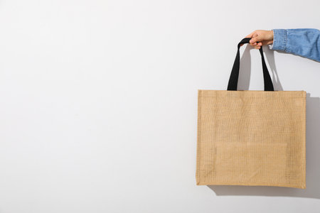 Bag in hand on a white backgroundの写真素材