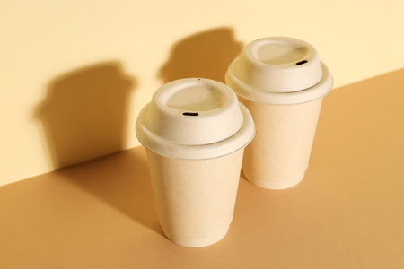 Paper cups with lids on a light backgroundの写真素材