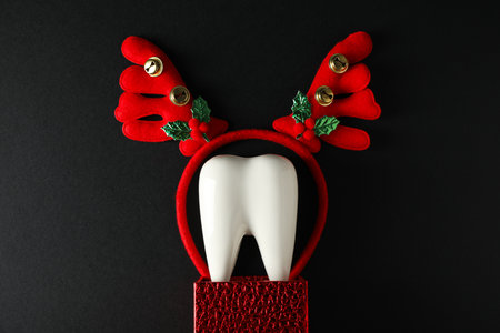 Teeth with Christmas accessories around, flat lay.の写真素材