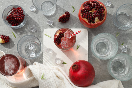 Red cocktail with fresh pomegranate on a white backgroundの写真素材