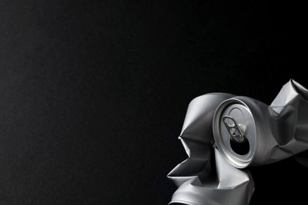 Two silver colored tin cans on black background, space for textの写真素材