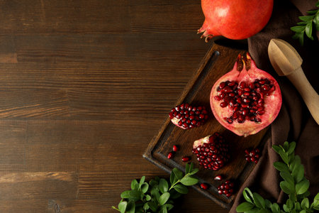 Fresh juicy pomegranate on a dark backgroundの写真素材