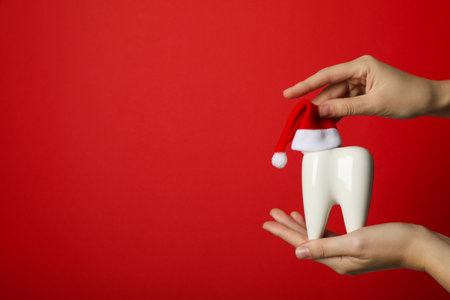 Teeth with Christmas accessories around, flat lay.の写真素材