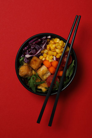 Fried tofu salad on a red backgroundの写真素材