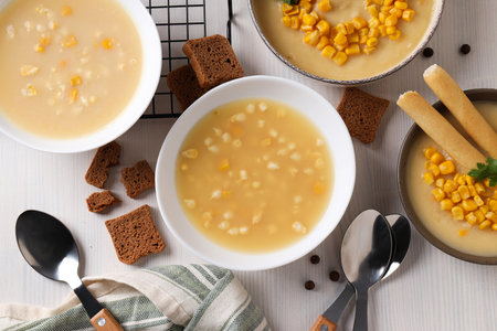 Corn soup in plates, top view, on a light background.の写真素材