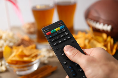 Beer with snacks, a rugby ball and an American flag