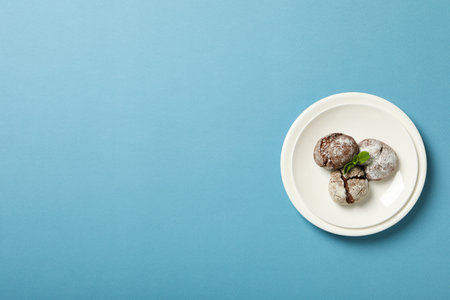 Appetizing crinkle cookies, on a blue background.の写真素材