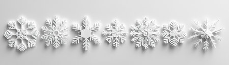 White paper snowflakes in a row on a white background, created with Generative AI technologyの素材