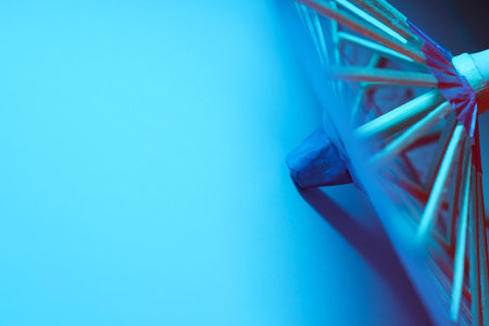 A beautiful Japanese umbrella with blue illuminationの写真素材