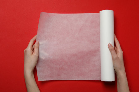 White baking paper on a red background