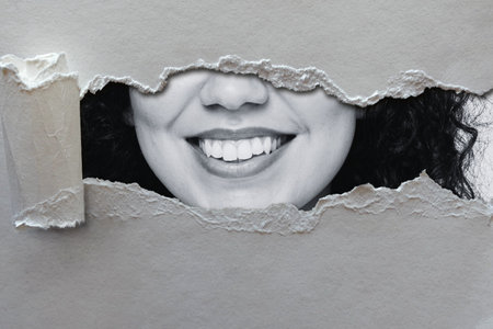 Creative design, smiling girl, close-up, black and white image.