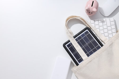 Portable black solar panel with piggy bank and keyboardの写真素材