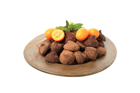 PNG, Chocolate truffles in a bowl with kumquats isolated on white backgroundの写真素材