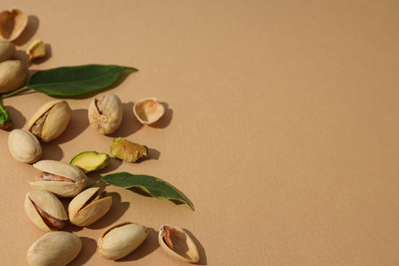 Pistachios on a beige background.の写真素材