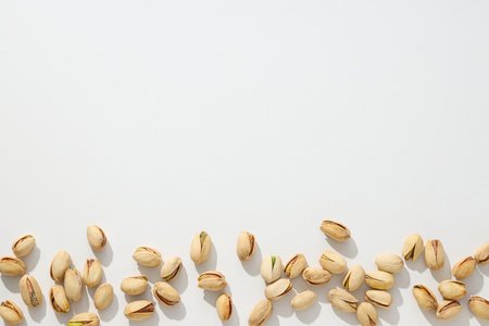 Pistachios in the shell, on a light background.