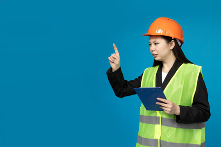 A girl of Asian appearance in the form of a construction manager.