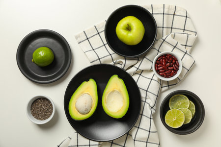 Set of vegan protein products on plate and towel on white background, top viewの写真素材