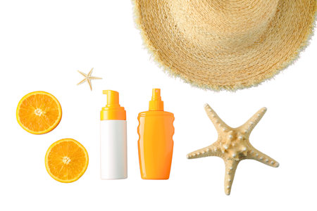 Sunscreen bottles and summer items arranged for a beach getaway, isolated on white