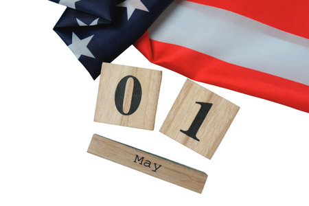 Wooden blocks show May 1 with an American flag, isolated on white