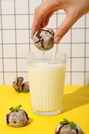 Appetizing Grinkle cookies with milk, on a yellow background.の写真素材