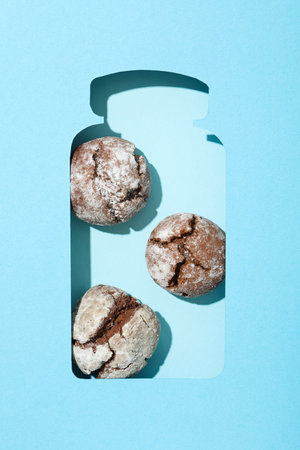 Appetizing crinkle cookies, on a blue background.の写真素材