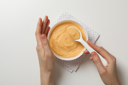 Children's vegetable and fruit puree, on a light background.の写真素材