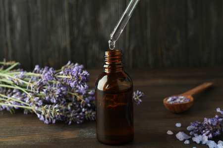 Lavender oil in a bottle with a dropper close-upの写真素材