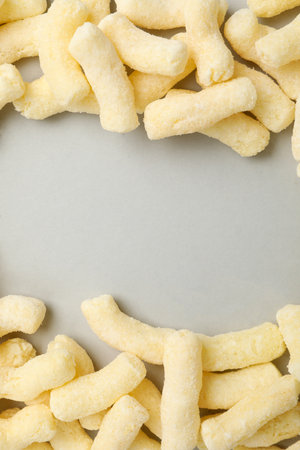 Many corn sticks on light gray background, space for textの写真素材