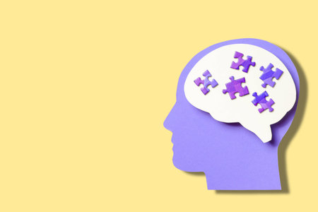 Colorful design featuring a silhouette with puzzle pieces