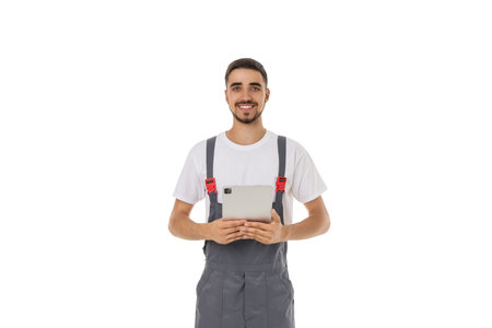 Worker smiles with tablet on site, isolated on white, PNG