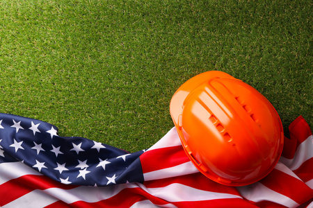 Hard hat placed on the American flag to honor workers