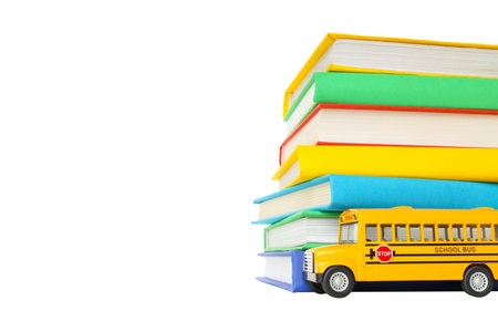 Books and a toy bus await school season, isolated on white, PNG