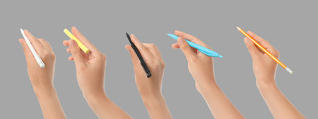 Hands gripping pens of different colors ready for creative tasks