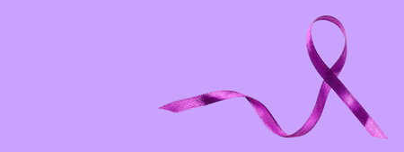 A purple ribbon on lavender symbolizes support for causesの写真素材