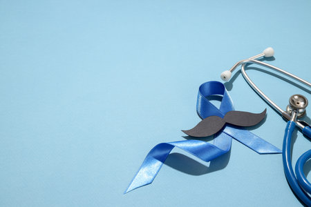 Prostate cancer awareness with blue ribbon and stethoscopeの写真素材