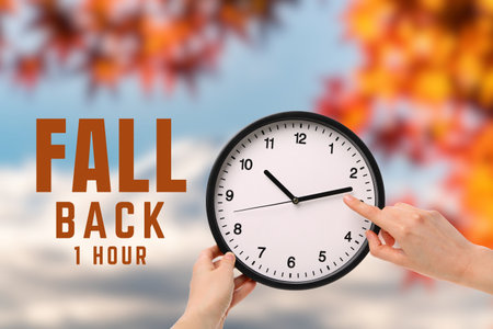 Clock at 2 o'clock with autumn leaves behind