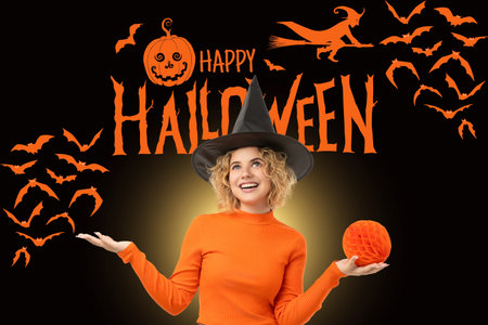 Cheerful woman holds pumpkin while celebrating Halloween timeの写真素材