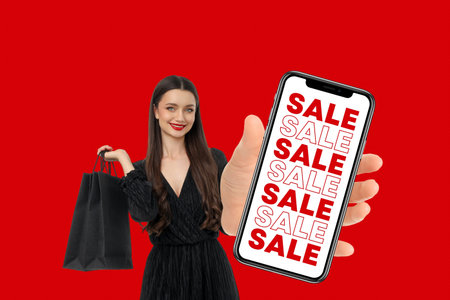 Woman smiles with a shopping bag and sale alerts phone